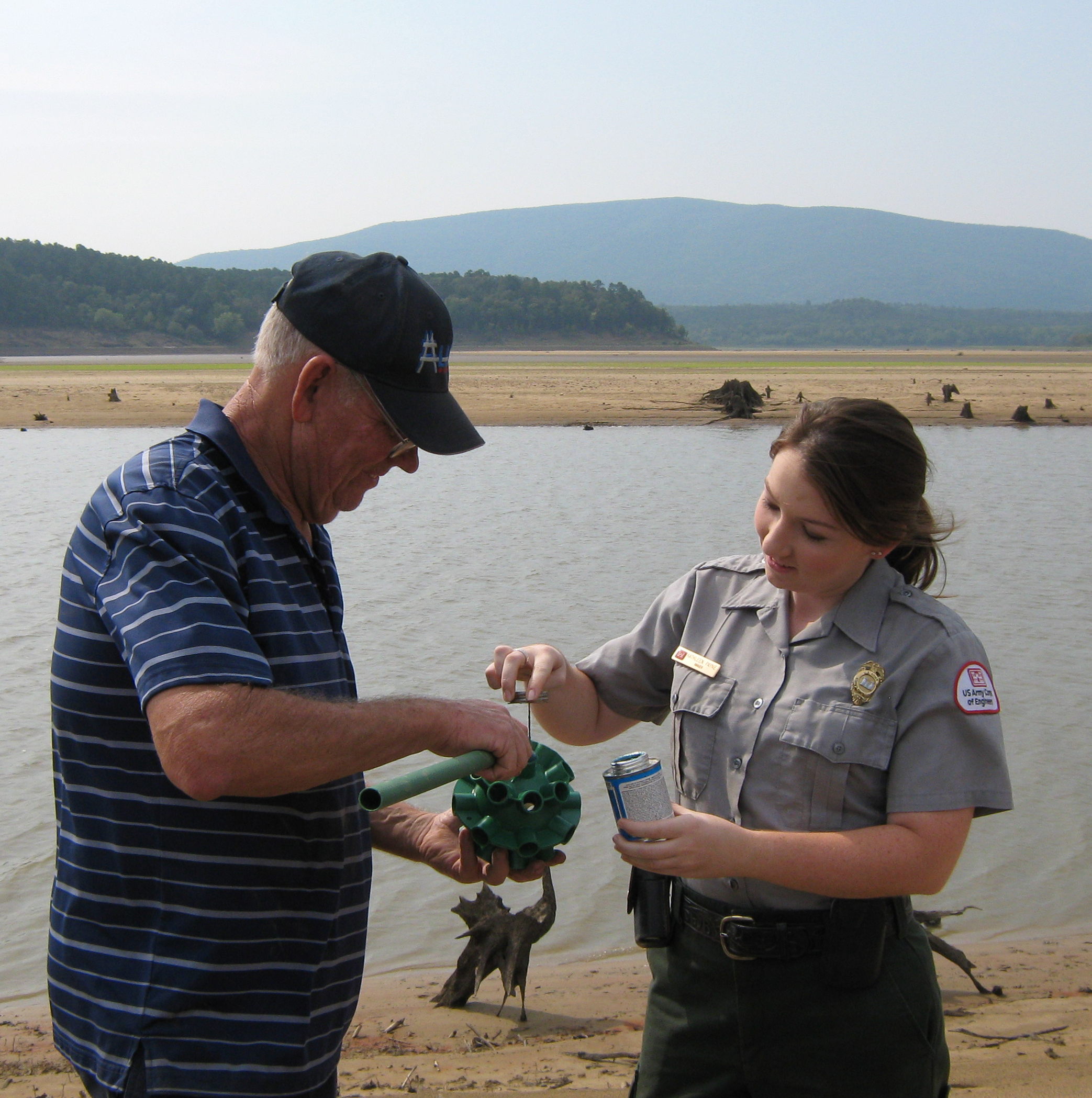 Volunteer and Park Ranger putting together a fish shelter