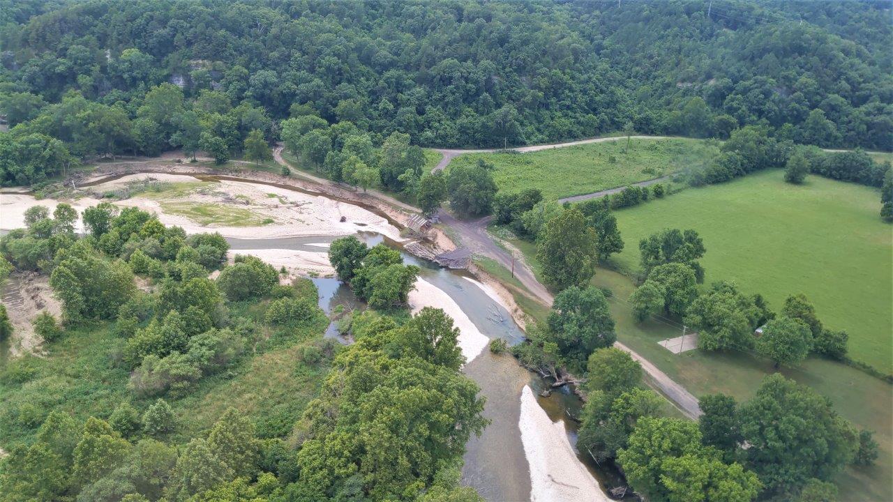 Bank erosion along the Illinois River caused by flooding An eroded bank along the Illinois River showing flood damage